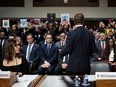 Meta CEO Mark Zuckerberg, with back to camera, speaks to victims and their family members as he testifies during the U.S. Senate Judiciary Committee hearing "Big Tech and the Online Child Sexual Exploitation Crisis" in Washington, DC, on January 31, 2024.