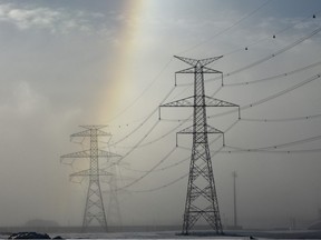 One side of a sun dog appears over power line towers outside Edmonton, AB.