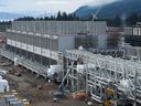 Cooling towers used to dissipate heat generated when natural gas is converted into liquefied natural gas are seen under construction at the LNG Canada export terminal in Kitimat, B.C. on Wednesday, September 28, 2022.