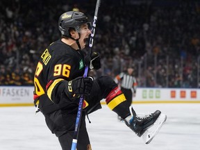Vancouver Canucks' Andrei Kuzmenko celebrates a goal.