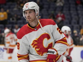 Calgary Flames forward Elias Lindholm (28) warms up before a game.