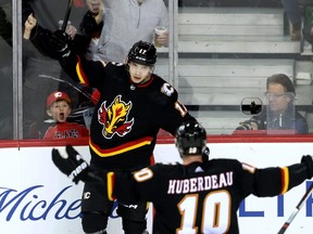 Calgary Flames' Yegor Sharangovich celebrates a goal.