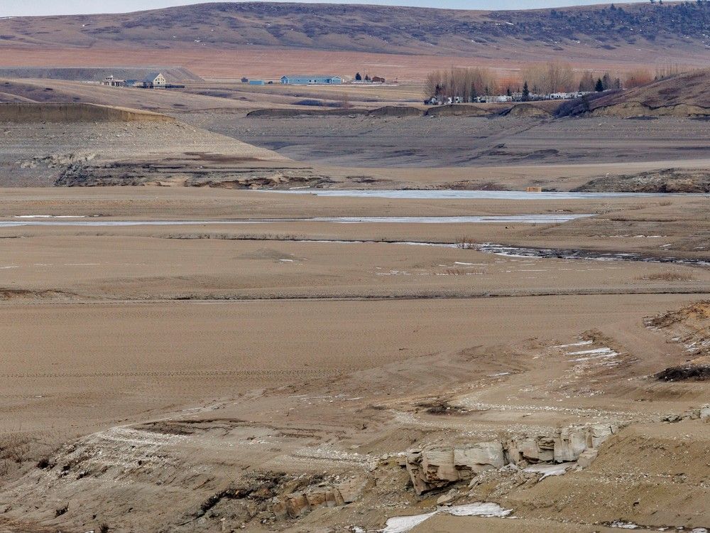 Looking east along the Crowsnest River valley where the river enters the nearly-dry Oldman Reservoir north of Cowley, Alberta, on Monday, December 18, 2023.