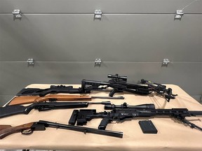 Stolen weapons seized during a search warrant at a northwest Calgary residence