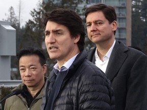 Prime Minister Justin Trudeau makes a housing announcement with the Premier of British Columbia, David Eby, and Vancouver Mayor Ken Sim at the University of British Columbia in Vancouver on Feb. 20, 2024.