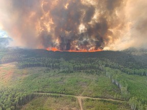 Smoke rises from the Bald Mountain Fire GWF 019 in the Grande Prairie Forest Area near Grande Prairie, Alberta, Canada May 12, 2023.
