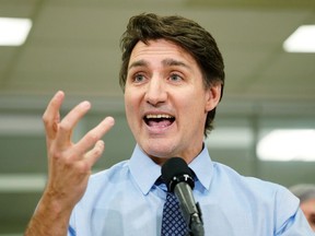 Prime Minister Justin Trudeau answers questions at a news conference in Calgary on Wednesday, March 13, 2024.