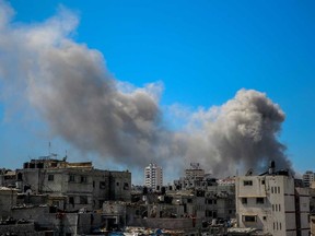 A picture shows smoke billowing after Israeli bombardment in the vicinity of the Al-Shifa hospital in Gaza City on March 23, 2024, amid ongoing battles between Israel and the militant group Hamas.