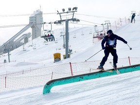 Skiers at WinSport in late March