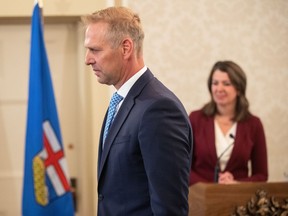 Alberta's government says it is updating its electricity market rules in order to help lower consumers' utility bills. Utilities Minister Nathan Neudorf is sworn into cabinet in Edmonton, Friday, June 9, 2023.