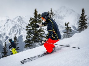 A couple of skiers make turns down the Red Crow off the Gold Chair at Nakiska on Wednesday, March 27, 2024