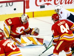 Calgary Flames goalie Dustin Wolf is scored on by Washington Capitals Alex Ovechkin in second period action