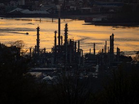 Simpson Oil Ltd. says it will evaluate its options to protect its shareholder rights once restrictions under an agreement that limits its ability to nominate and vote for board members at Parkland Corp. expire on March 31. A boat travels past the Parkland Burnaby Refinery on Burrard Inlet at sunset in Burnaby, B.C., on Saturday, April 17, 2021.