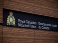 The RCMP logo is seen outside Royal Canadian Mounted Police "E" Division Headquarters, in Surrey, B.C., on Friday April 13, 2018. The Liberal government is looking for ways to improve policing services provided under contract by the RCMP across Canada -- eyeing everything from overall cost and sustainability to stronger oversight and accountability.