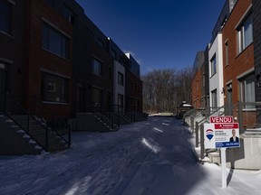 The Canadian Real Estate Association is expected to release February home sales figures on Monday. A "sold" sign in a new housing development in Lasalle, a borough of Montreal, is shown on Monday, Feb. 19, 2024.