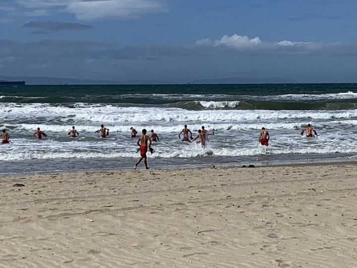  Lifeguard cadets on Huntington Beach were put through the paces during a rainy morning swim and run. When they thought they were done, their head instructor made them go again. Photo, Michele Jarvie