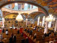 Churchgoers light candles