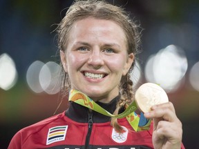 Canada's Erica Wiebe displays her gold medal after defeating Kazakhstan's Guzel Manyurova to win their women's 75kg freestyle wrestling gold medal match at the 2016 Summer Olympics in Rio de Janeiro, Brazil on Thursday, August 18, 2016. Wiebe announced her retirement from competition on Wednesday.