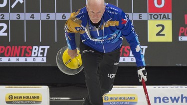 Glenn Howard takes back his stone during his delivery during a match in 2022.