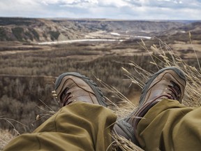 Relaxing on the cliff edge at Dry Island Buffalo Jump east of Huxley, Ab., on Tuesday, April 9, 2024.