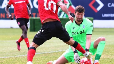 Cavalry Sergio Camargo (10) gets a shot on Pacific keeper Sean Melvin during CPL soccer action between Pacific FC and Cavalry FC on ATCO Field at Spruce Meadows in Calgar