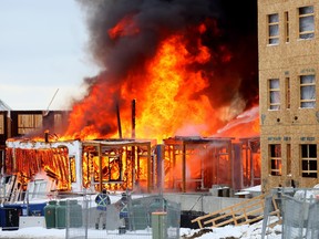 Calgary Fire battle a fire at a construction site on Arbour Lake Rd. N.W. in Calgary on Friday, April 5, 2024.