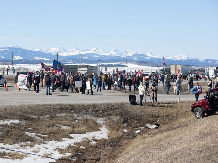  Demonstrators line the Trans-Canada Highway west of Calgary protesting the carbon tax on Monday, April 1, 2024. The Trans-Canada was reduced to one lane by the demonstrators west of the Highway 22 junction.