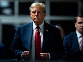 Former U.S. President Donald Trump walks out of the courtroom following the first day of jury selection at Manhattan Criminal Court in New York City on April 15, 2024.