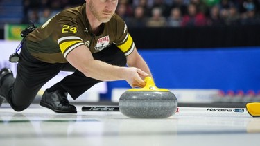Team Manitoba-Carruthers skip Brad Jacobs delivers a rock while playing Team Canada during the playoffs at the Brier, in Regina, Friday, March 8, 2024. Jacobs is a free agent after announcing Wednesday that he is parting ways with Reid Carruthers and his Manitoba-based curling team.