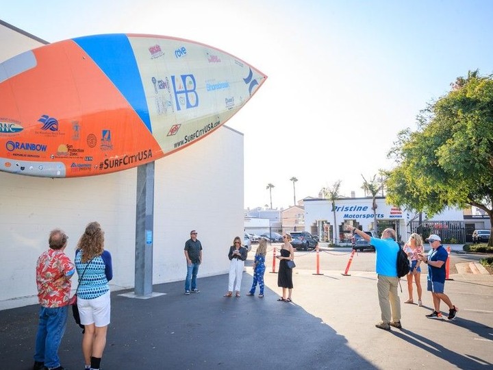 One of the stops on a guided walking tour of Huntington Beach is the International Surf Museum. Hanging on the outside wall is a 42-foot surfboard that garnered two entries in the Guinness Book of Records for the world’s largest surfboard and the most people to ride a surfboard. Courtesy, Visit Huntington Beach