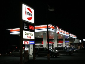 Drivers line up at a Pioneer gas station in Carleton Place, Ont., on Saturday, Nov. 8, 2008.