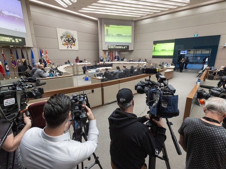  Calgary’s city council hears from administration during a public hearing into proposed blanket rezoning plan at city hall on Monday, April 22, 2024. Hundreds packed the Municipal Centre, both in council chambers and in the common areas, where overflow seating was created with screen to view the meeting. Brent Calver/Postmedia