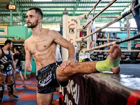 This undated photo shows Calgary-based bantamweight Jake Peacock training ahead of his One Championship debut in Bangkok on Friday in a Muay Thai bout against Japan's Kohei Shinjo. Peacock, who hold several titles, does not have a right hand because the amniotic band was wrapped around his arm in the early stages of development, which stopped it from growing.
