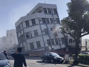 In this image taken from a video footage run by TVBS, a partially collapsed building is seen in Hualien, eastern Taiwan on Wednesday, April 3, 2024. A powerful earthquake rocked the entire island of Taiwan early Wednesday, collapsing buildings in a city and creating a tsunami that washed ashore on Japanese islands. (TVBS via AP)