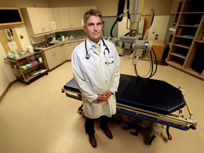 Oncologist Dr Brock Debenham poses for a photo in a radiation treatment room at the Cross Cancer Institute, in Edmonton Thursday May 30, 2024.