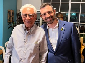 “To all survivors, I say, be happy,” says Holocaust survivor Dr. Arnold Clevs, left, with Zikaron BaSalon host Eylon Levy.