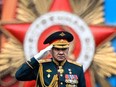 Russian Defence Minister Sergei Shoigu salutes to soldiers as he is driven along Red Square during the Victory Day military parade in central Moscow on May 9, 2024