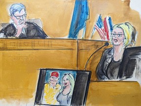 In this courtroom sketch, Stormy Daniels testifies on the witness stand as Judge Juan Merchan listens in Manhattan Criminal Court in New York, Tuesday, May 7, 2024. A photo of Donald Trump and Daniels from their first meeting is displayed on a monitor.
