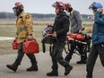 Alberta Wildfire crews return from fighting wildfires near Fort McMurray, Alta., Thursday, May 16, 2024.