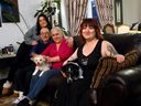 Faya Shlah,RT, with her dogs Sif and Rocket and family L-R, sister, Ramina and parents, Fayez and Jina as Faya was forced to move home after getting laid off in Calgary on Wednesday, March 6, 2024. Darren Makowichuk/Postmedia