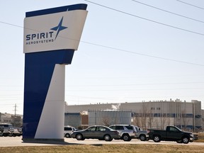 FILE - The Spirit AeroSystems sign is seen, July 25, 2013, in Wichita, Kan. The key Boeing supplier that makes the fuselages for its popular 737 Max airplanes confirmed Thursday, May 16, 2024, that it is laying off about 450 workers because production has slowed down ever since a panel flew off of one of those airplanes operated by Alaska Airlines in midair in January.