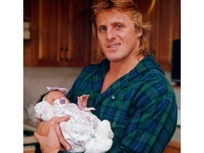 Owen Hart with his baby girl