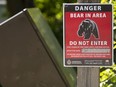 A warning sign warns of bears in the area.