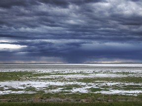 More evening storm clouds over nearly-dry Dead Horse Lake near Hussar, Ab., on Monday, June 3, 2024.