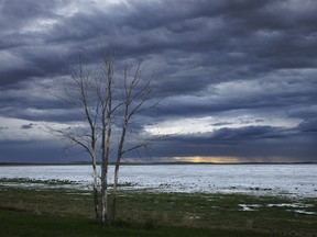 More evening storm clouds over nearly-dry Dead Horse Lake near Hussar, Ab., on Monday, June 3, 2024.
