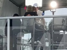 Rory McIlroy hugs Amanda Balionis during an interview at the Canadian Open.