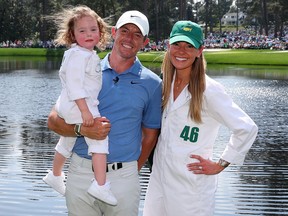 Rory McIlroy poses for a photo with his now-estranged wife, Erica Stoll and daughter Poppy at the 2023 Masters.