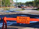 Debris from a major water system break the night before is seen near 16 Ave and Home Rd NW in Calgary on Thursday, June 6, 2024. The City of Calgary has issued a boil water advisory and Stage 4 outdoor watering ban for affected residents and businesses.