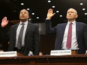 Boeing president and CEO Dave Calhoun, right, and Boeing chief engineer Howard McKenzie are sworn in during a Senate Homeland Security and Governmental Affairs Committee Investigations Subcommittee hearing to examine "Boeing's broken safety culture" on Capitol Hill in Washington, DC, June 18, 2024.