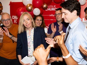 Liberal candidate for Toronto-St. Paul’s, Leslie Church, left and Liberal Leader Justin Trudeau, right, speak to supporters at a campaign volunteer event, in Toronto on Thursday, May 30, 2024.